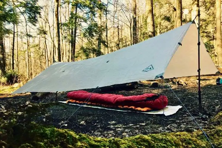 Pitch a tarp to survive heavy winds